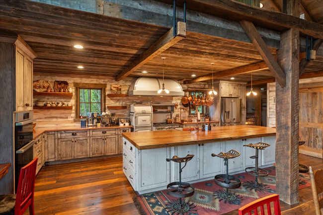 Gourmet Kitchen with copper & chestnut counter tops. | Image 12