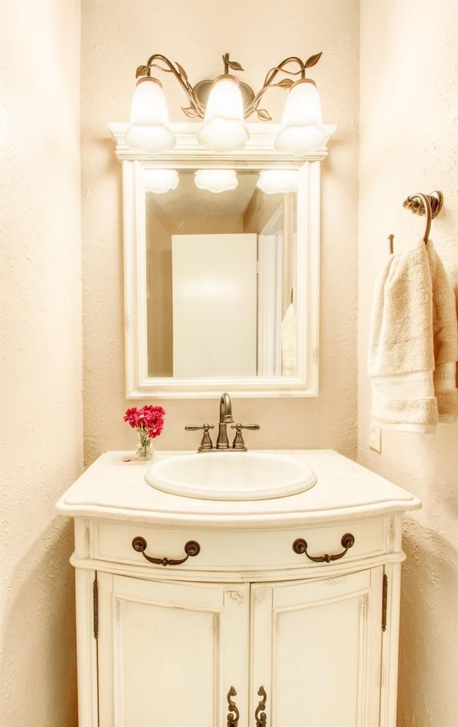 Bathroom featuring vanity and a textured wall | Image 18