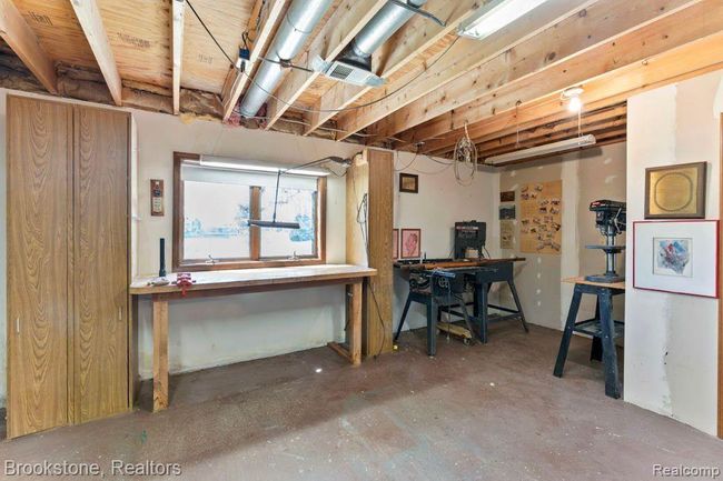 Work shop in Basement with egress window | Image 24