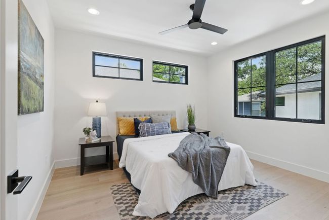 Bedroom with recessed lighting, light wood-type flooring, baseboards, and a ceiling fan | Image 16