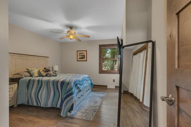 Main level features a second bedroom, perfect for guests or multi-purpose use. | Image 22
