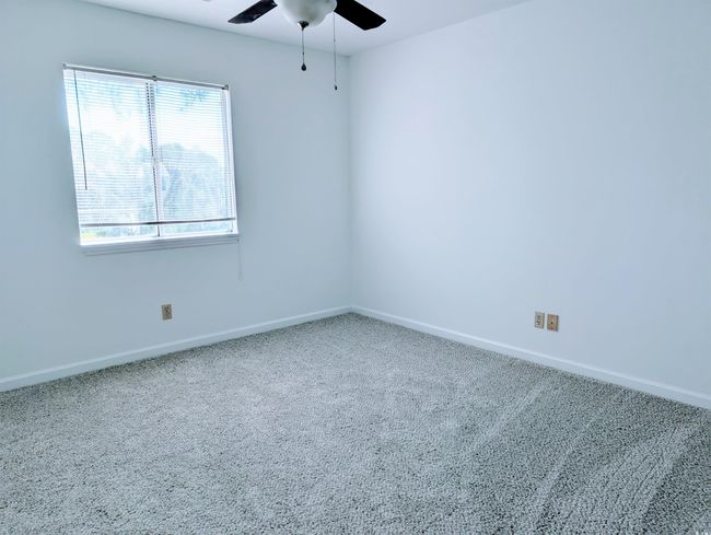Empty room featuring a ceiling fan and carpet | Image 10
