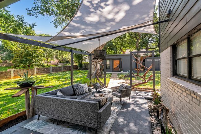 Fenced backyard featuring an Guest House and Shed. storage shed, and a patio area | Image 29