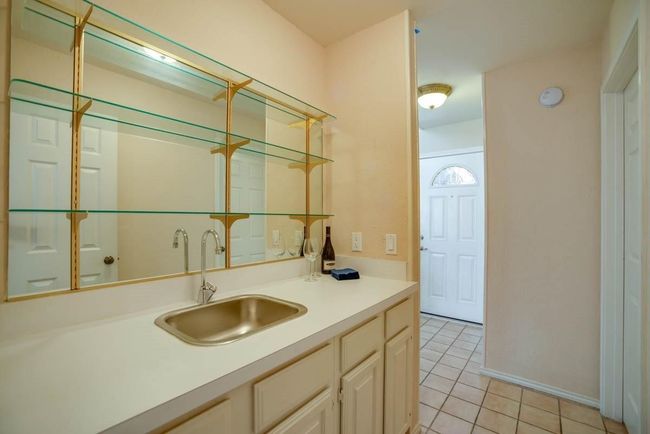 Indoor wet bar with light tile patterned flooring | Image 14