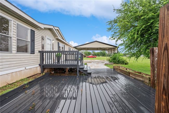 Wooden deck with a lawn | Image 4