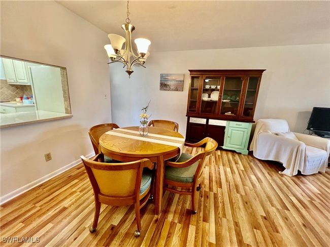 Dining space with pass thru from the kitchen. | Image 10