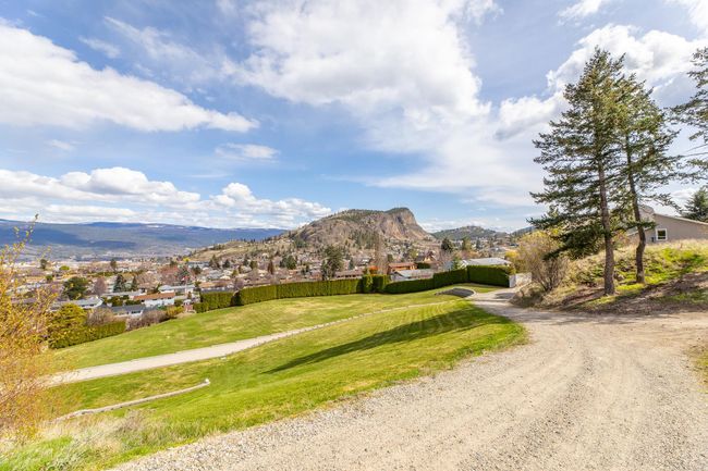 Exterior space with a residential view, a mountain view, and a lawn | Image 9