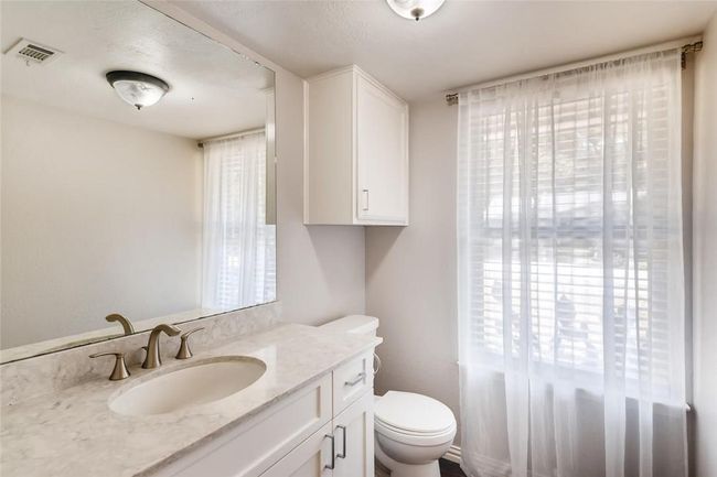 Half bath featuring toilet and vanity | Image 17