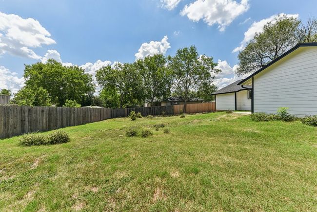 View of fenced backyard | Image 34