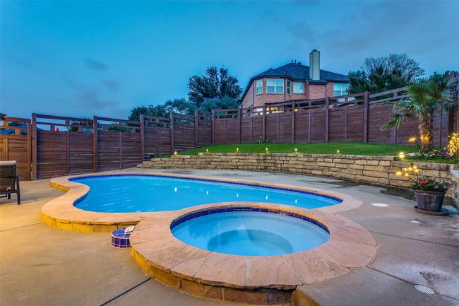 View of pool with an in-ground hot tub, a fenced backyard, and a patio | Image 27