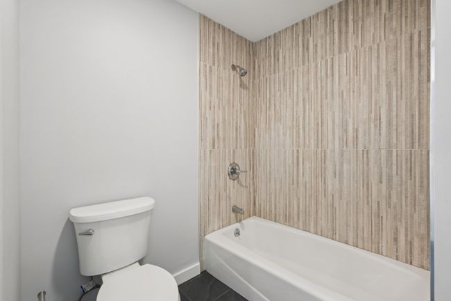 Bathroom featuring tile patterned floors and shower / washtub combination | Image 17