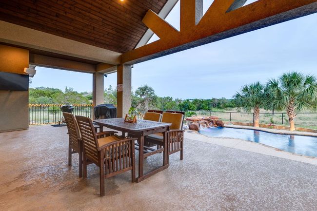 View of patio featuring outdoor dining space and a grill | Image 27