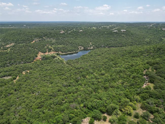 Aerial view with a wooded view and a water view | Image 15
