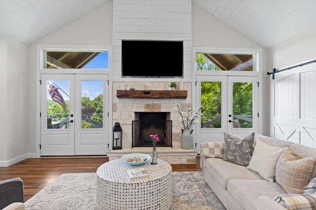 Texas Limestone fireplace TV automatically lowers for easy viewing. | Image 19