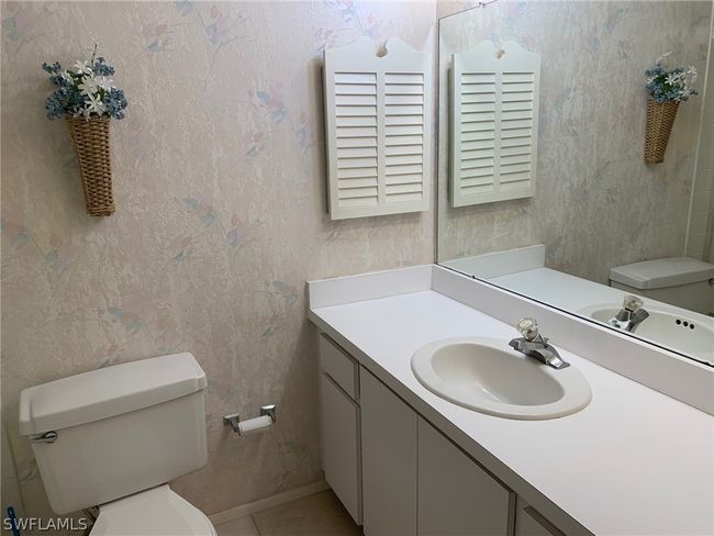 Bathroom featuring vanity and toilet | Image 19
