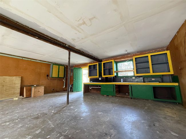 Basement with a workshop area | Image 17