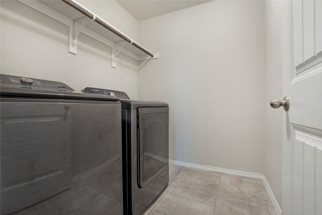 Laundry room with separate washer and dryer | Image 32