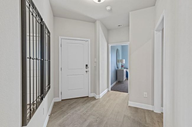 Foyer featuring light wood-style floors and baseboards | Image 20