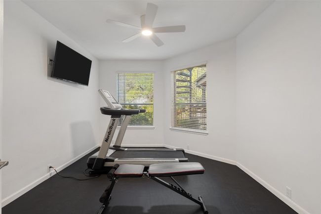 Workout area with baseboards and ceiling fan | Image 31