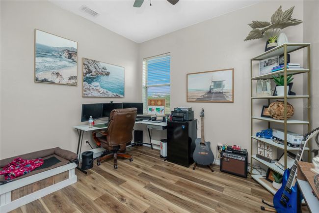 Guest Room currently utilized as a home office. | Image 39
