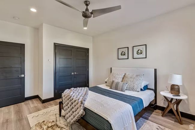 Bedroom featuring recessed lighting, a closet, light wood-style flooring, and baseboards | Image 63