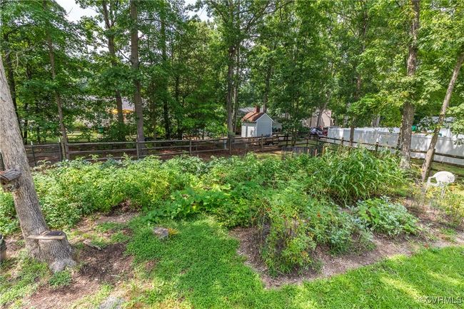 View of fenced backyard | Image 43