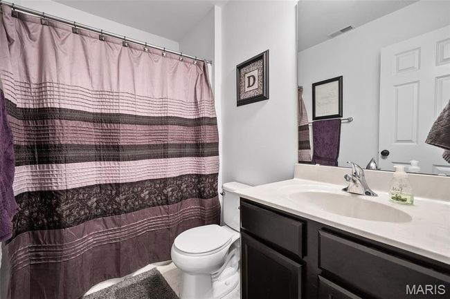 Full bath with vanity and curtained shower | Image 34