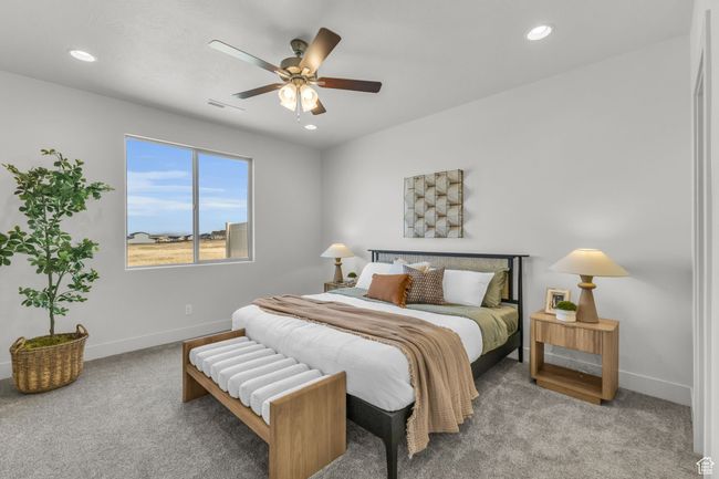 Carpeted bedroom featuring ceiling fan | Image 16