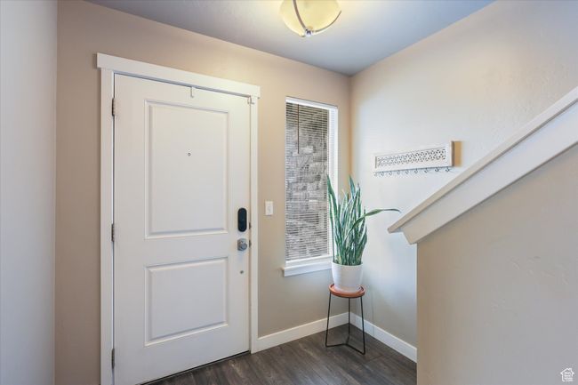 Entrance foyer with baseboards and dark wood finished floors | Image 20