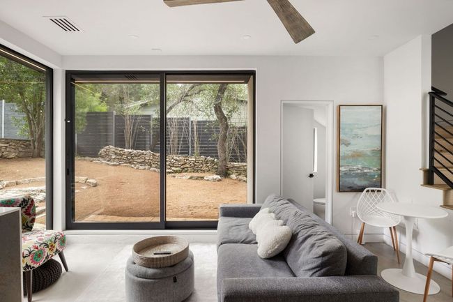 Living area with plenty of natural light and ceiling fan | Image 35