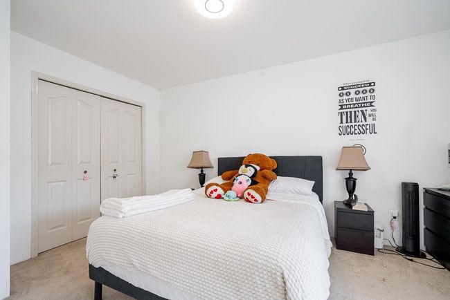 Bedroom with light colored carpet and a closet | Image 22