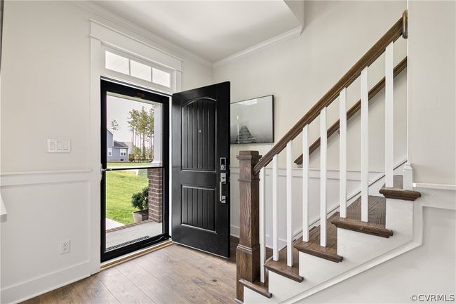 Entryway with ornamental molding and light hardwood / wood-style floors | Image 4