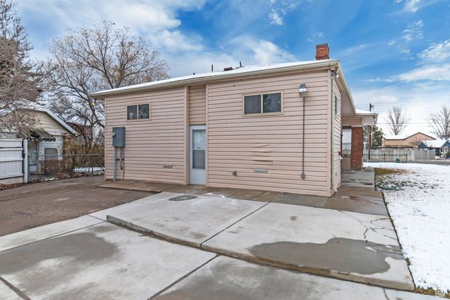 Back of property with a patio, fence, and a chimney | Image 27