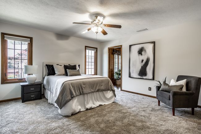 MAIN LEVEL primary bedroom with two large walk-in closets | Image 34