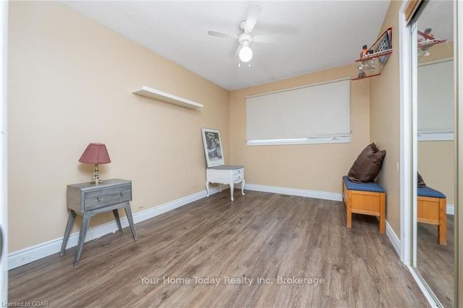 Living area featuring hardwood / wood-style floors and ceiling fan | Image 29