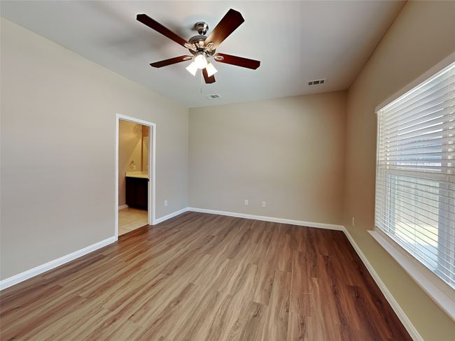 Spare room with light wood finished floors and a ceiling fan | Image 6