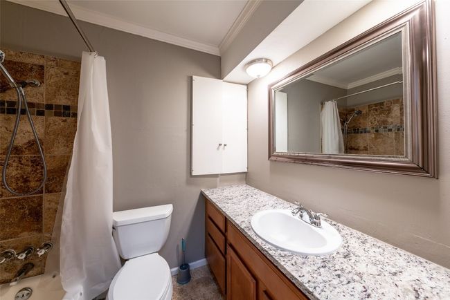 Bathroom featuring vanity and ornamental molding | Image 25