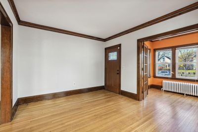 Front entry into living and sunroom with french doors and hardwood floors... | Image 2