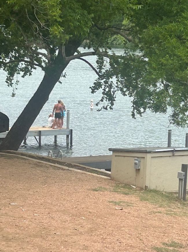 View of home's exterior with a water view and a boat dock | Image 29
