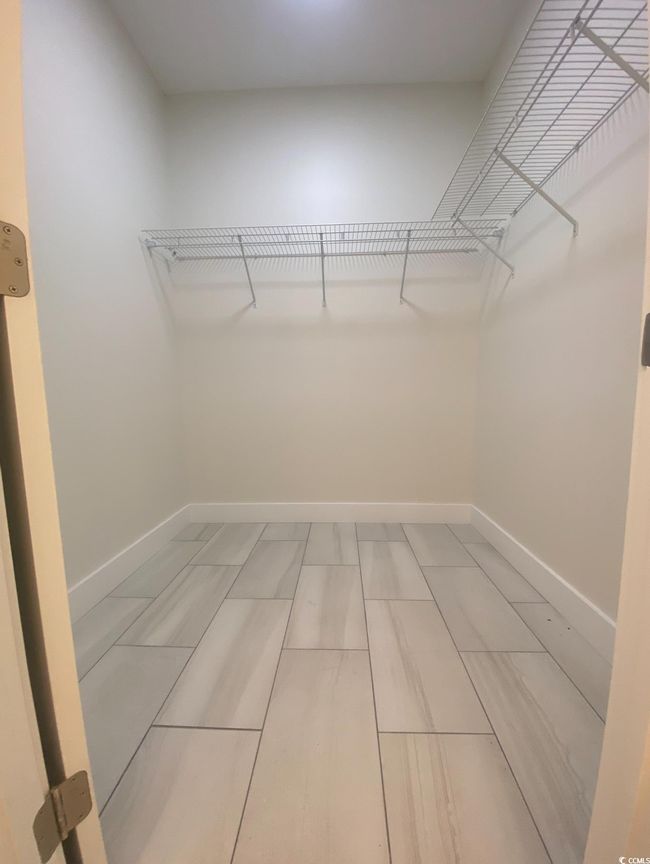 View of walk in closet | Image 20