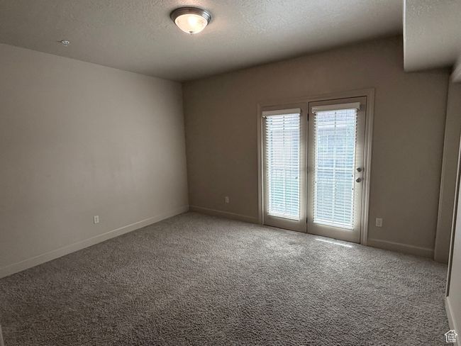 Carpeted spare room with baseboards and a textured ceiling | Image 14