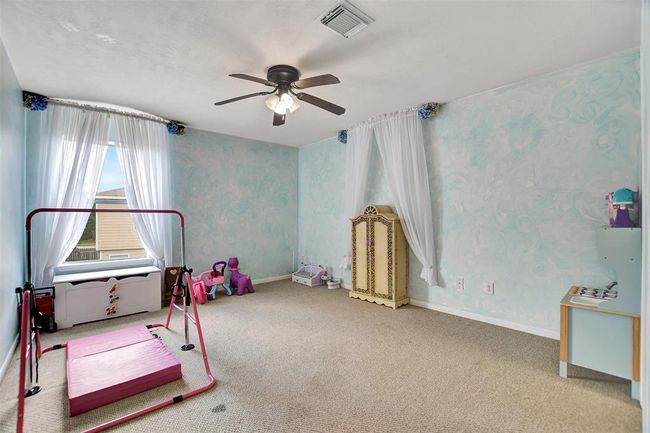 Charming secondary bedroom on the upper floor, perfect for kids or guests. | Image 38