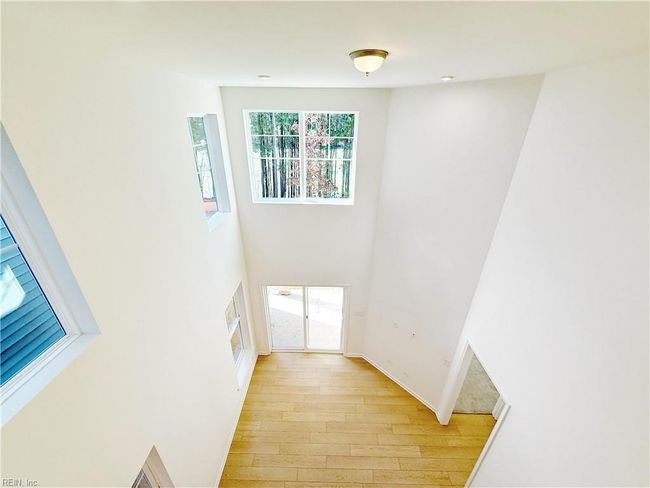 Spacious and bright two-story family room. | Image 5