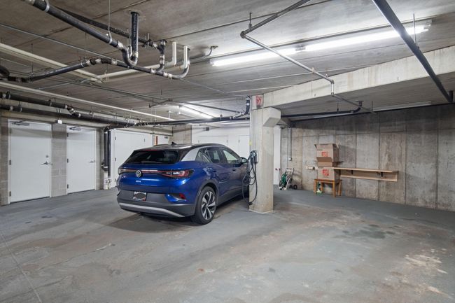 Three private heated parking stalls and storage in the garage | Image 54