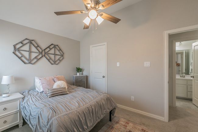 Bedroom featuring carpet, lofted ceiling, and ceiling fan | Image 26
