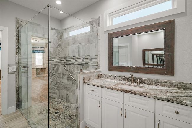 Separate sinks topped with Granite. Note the transom windows for natural light | Image 17