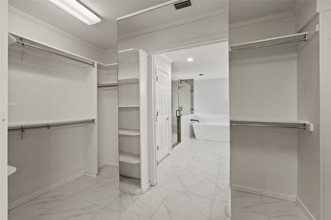 Spacious closet with marble look tile flooring | Image 26