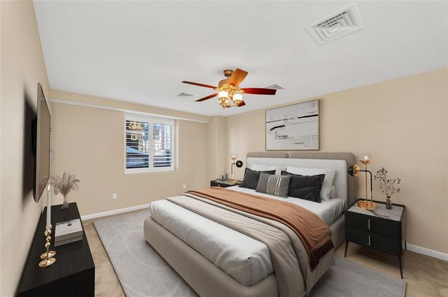 Primary Bedroom is approximately 18'x13'* allowing a king size bed and room for other furniture pieces or to create a Study or Sitting Area. Plantation shutters on all windows in home. *Buyer to verify dimensions. PHOTO VIRTUALLY STAGED. | Image 6