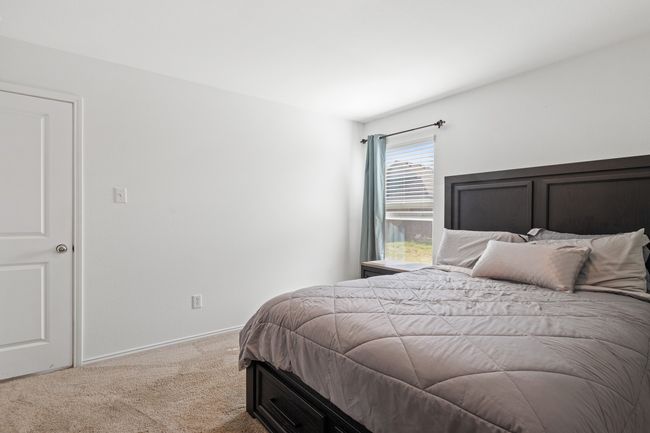 Carpeted bedroom featuring baseboards | Image 10