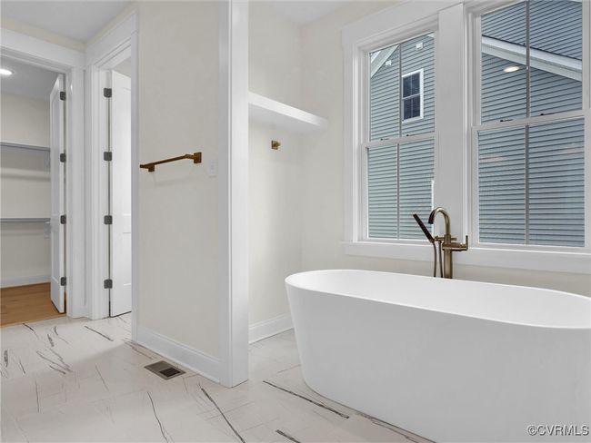 Photo represents the plan, not the actual home. Design selections may vary. The primary suite with walk-in closet and ensuite bath with walk-in shower and double vanity. | Image 13